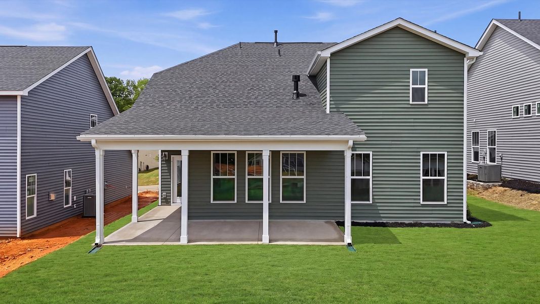 Refined rear exterior with a stylish covered porch for dining, relaxing, or entertaining located in Moore, SC