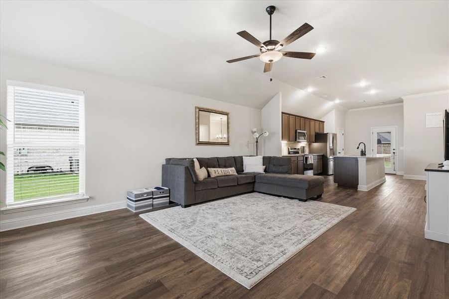 Open-concept living and kitchen area offering a bright, connected space perfect for everyday living and entertaining.