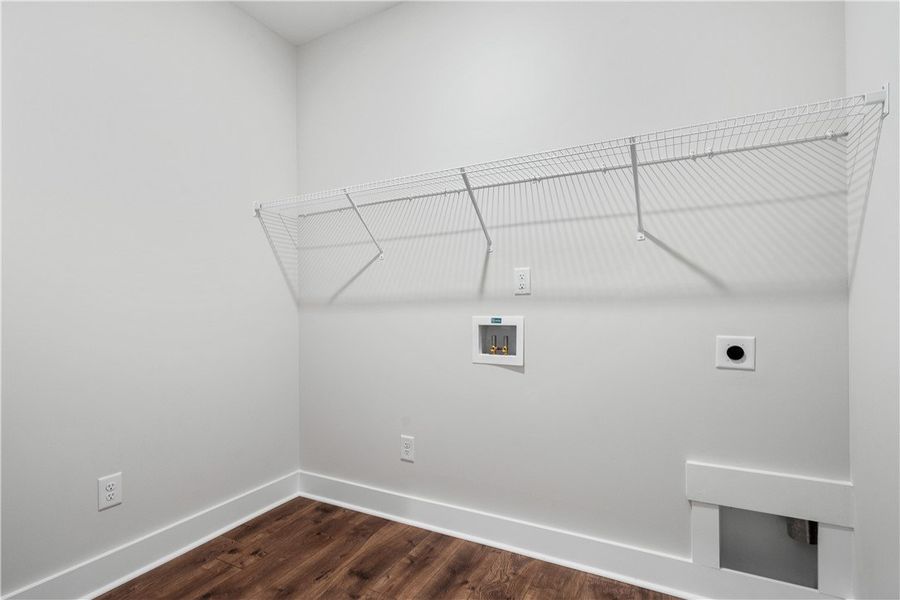 A well-appointed laundry room with wire shelving o