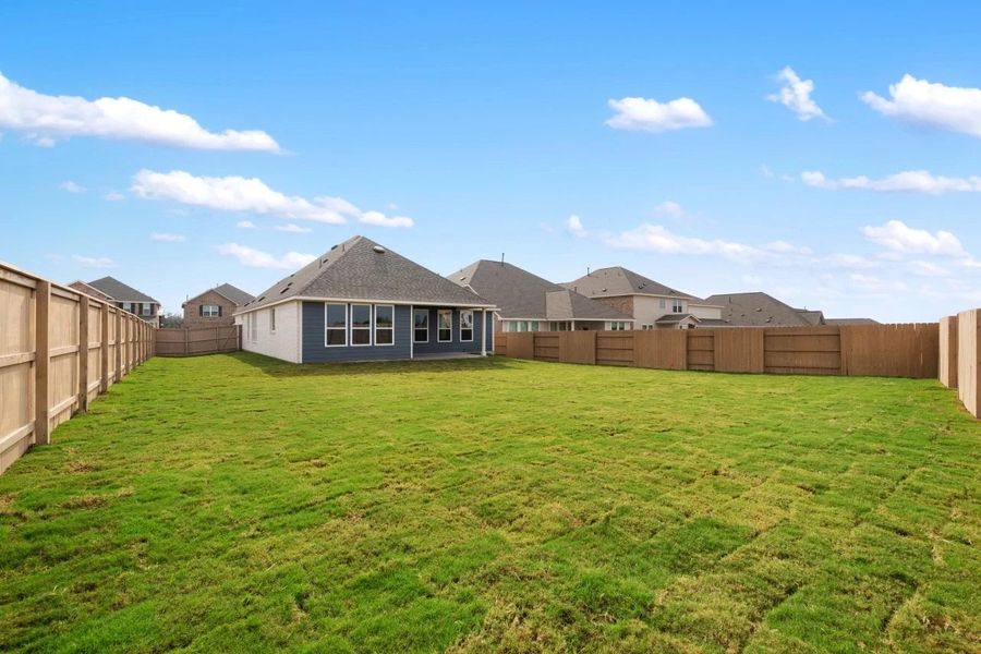 Exterior details and patio area of a home in The Colony 50s, Bastrop (Image 30).
