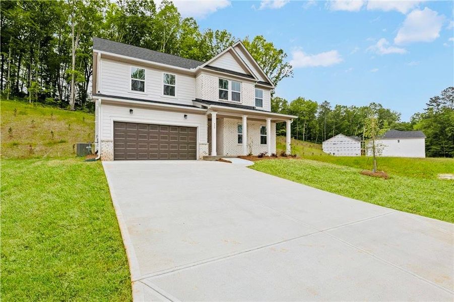 Front exterior of a new home in , Villa Rica, GA, highlighting curb appeal (Image 17).