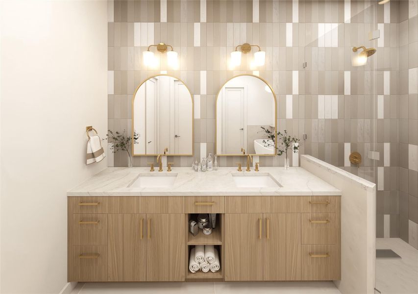 Double sinks under arched mirrors, tiled feature wall — the primary bath does not disapoint.