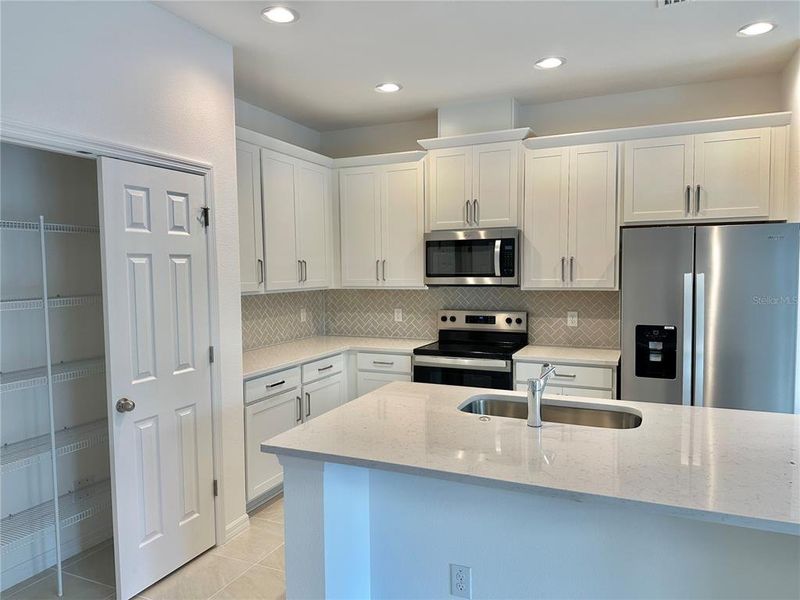 Furnished interior view inside a new home in Trinity Place, St. Cloud (Image 5).