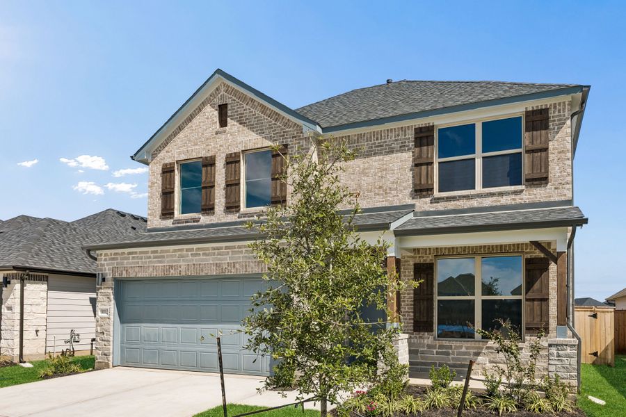 Front exterior of a new home in Riviera Pines, Huffman, TX, highlighting curb appeal (Image 22). Front exterior of a new home in Riviera Pines, Huffman, TX, highlighting curb appeal (Image 22).