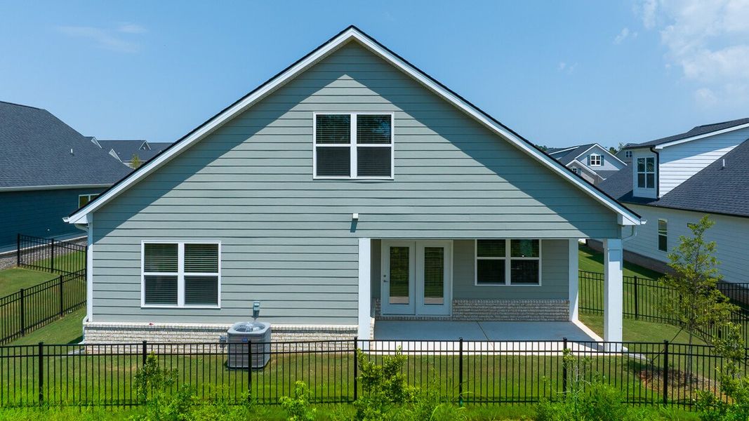 Exterior details and patio area of a home in Oak Ridge Meadows - Active Adult, Locust Grove (Image 3).