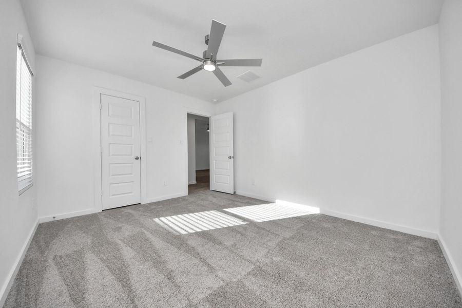 Secondary bedroom features plush carpeting, large windows that let in plenty of natural light, bright paint, and spacious closets. Secondary bedroom features plush carpeting, large windows that let in plenty of natural light, bright paint, and spacious closets.