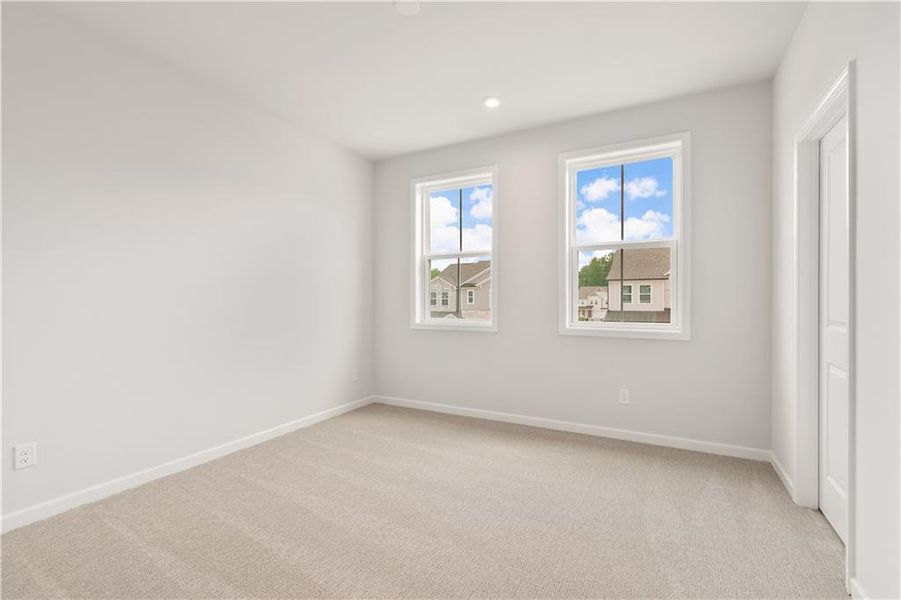 Spacious, unfurnished interior of a new home in The Paddocks at Doc Hughes, Buford (Image 30).