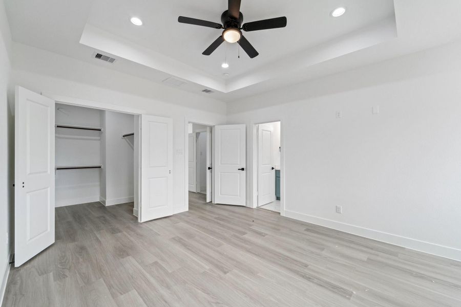 View of Primary Bedroom with Vaulted Ceilings and additional recessed lights! View of Primary Bedroom with Vaulted Ceilings and additional recessed lights!