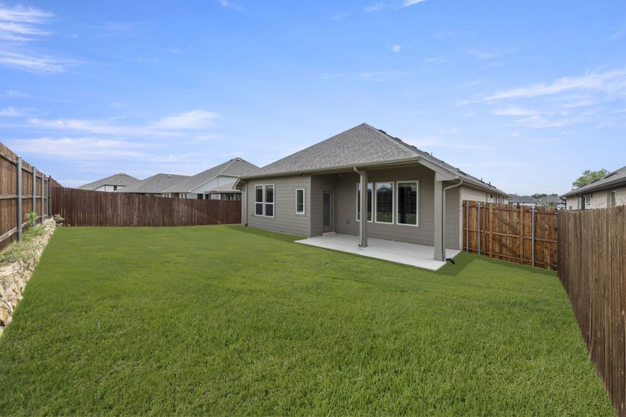 Exterior details and patio area of a home in Keeneland, Aubrey (Image 27).
