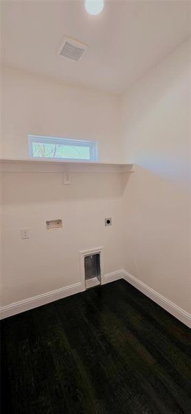 Laundry room with dark wood finished floors, electric dryer hookup, and hookup for a washing machine Laundry room with dark wood finished floors, electric dryer hookup, and hookup for a washing machine