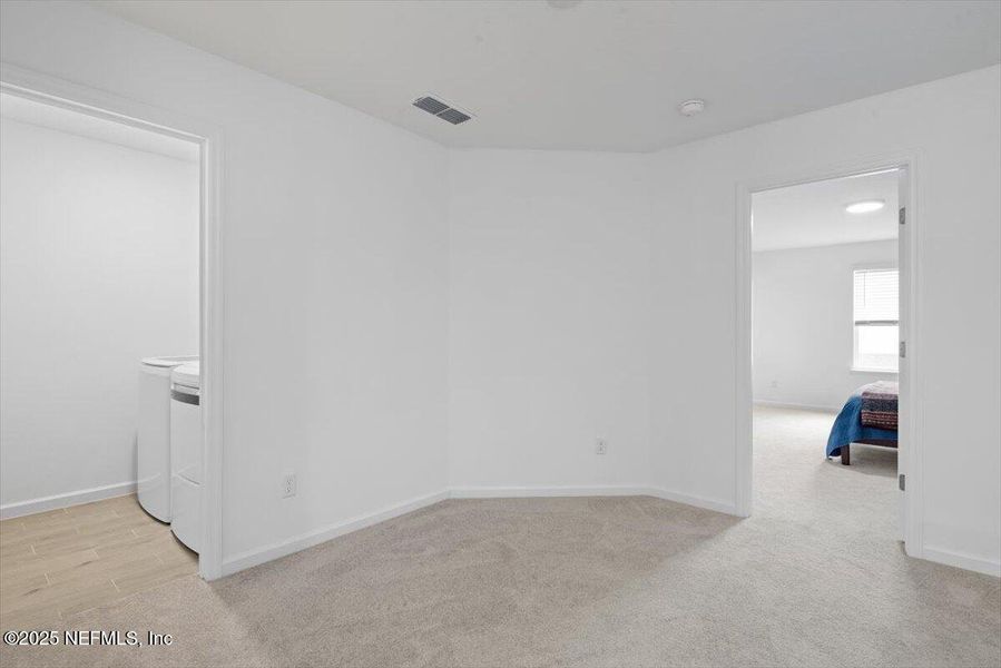 Spacious, unfurnished interior of a new home in Hardwick Farms: Hardwick Farms - Townhome Collection, Jacksonville (Image 42).