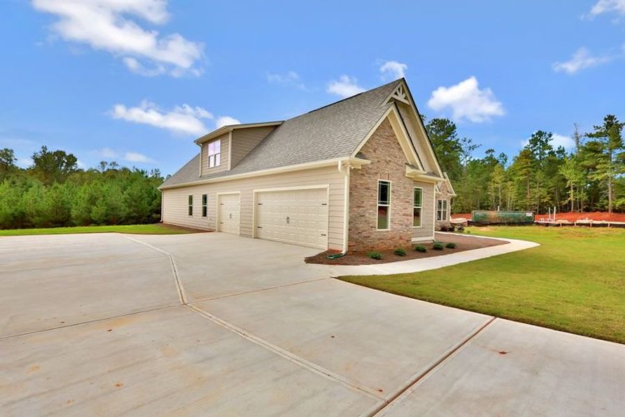 Representative exterior photo of a completed home built from the Candler by Dustin Shaw Homes in Platinum Ridge, Sharpsburg, GA (Image 48). Representative exterior photo of a completed home built from the Candler by Dustin Shaw Homes in Platinum Ridge, Sharpsburg, GA (Image 48).