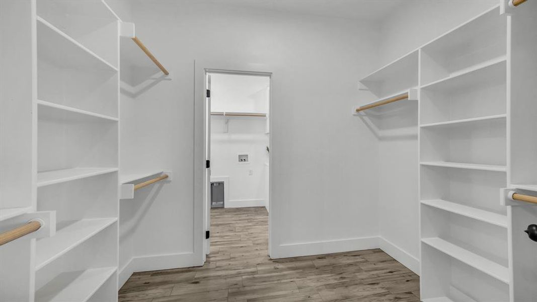 Primary closet conveniently opens up to the wonderful utiltity room