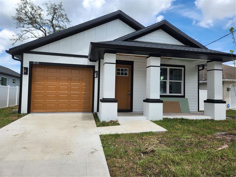 Front exterior of a new home in , Tampa, FL, highlighting curb appeal (Image 24). Front exterior of a new home in , Tampa, FL, highlighting curb appeal (Image 24).