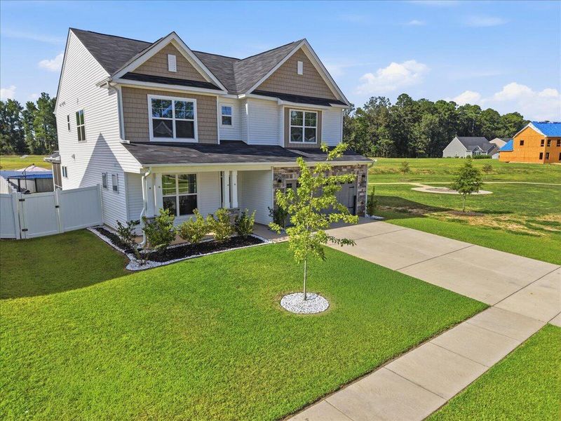 Front exterior of a new home in , Ridgeville, SC, highlighting curb appeal (Image 31). Front exterior of a new home in , Ridgeville, SC, highlighting curb appeal (Image 31).