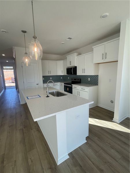 Furnished interior view inside a new home in Springwood Grove, Central (Image 4).