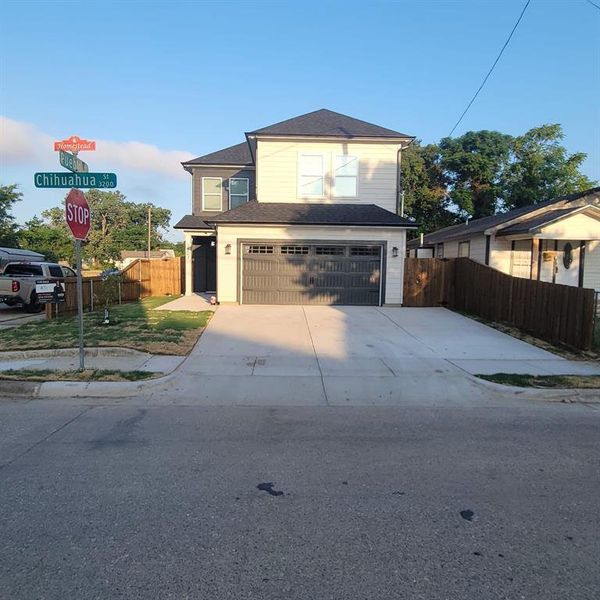 View of property featuring a garage