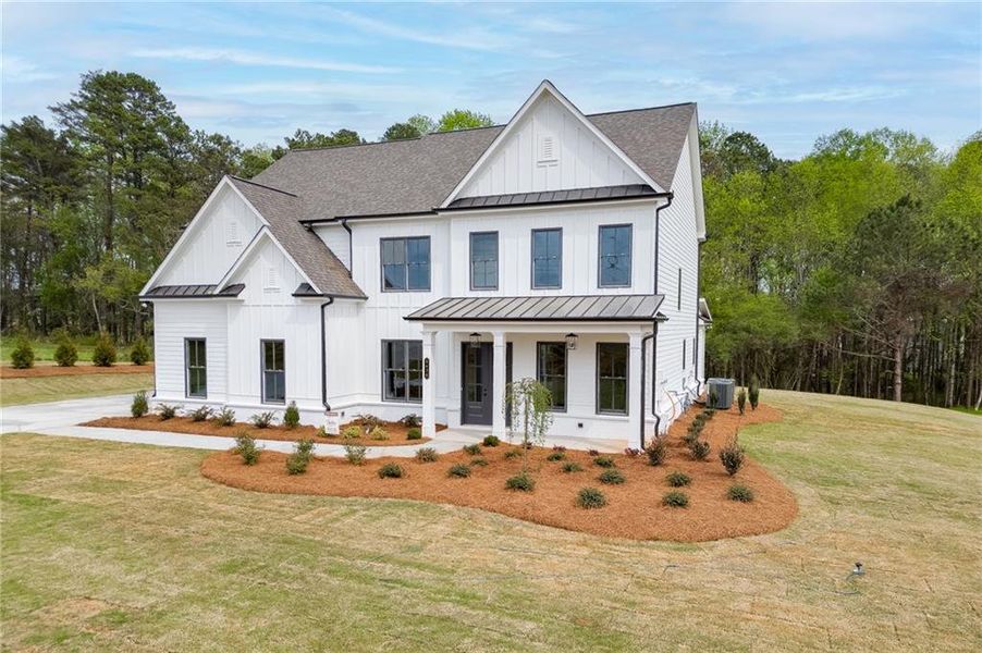 Front exterior of a new home in , Cumming, GA, highlighting curb appeal (Image 1). Front exterior of a new home in , Cumming, GA, highlighting curb appeal (Image 1).