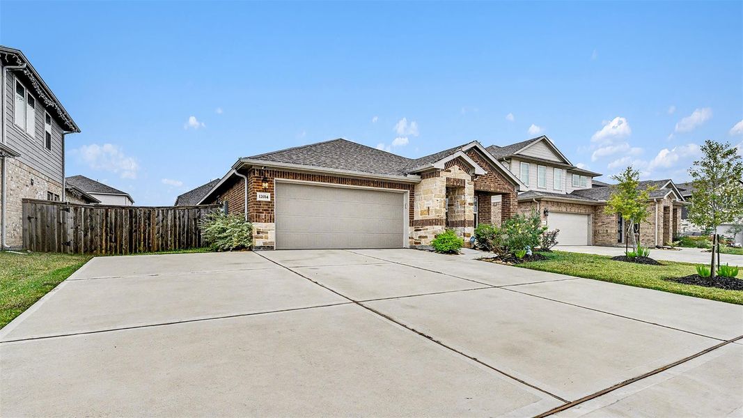 Front exterior of a new home in Heights of Barbers Hill, Baytown, TX, highlighting curb appeal (Image 20).