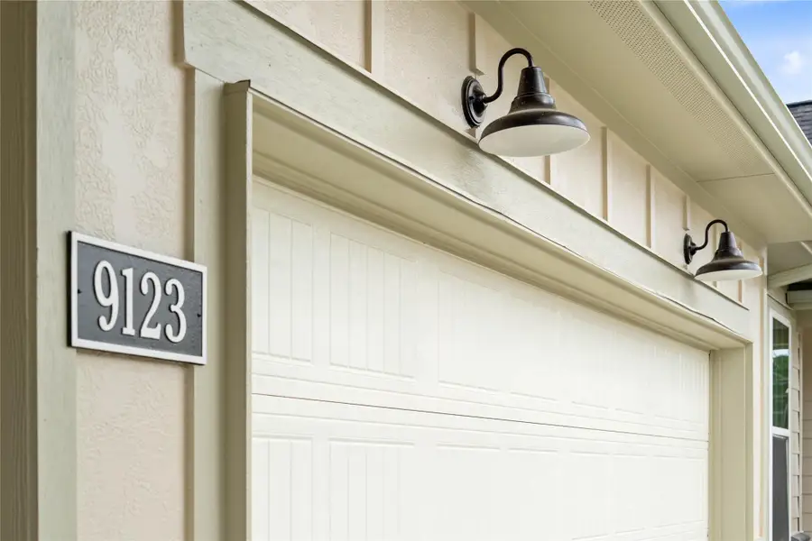 The property features stylish matte black gooseneck barn lights - providing ample illumination for safety and ambiance.