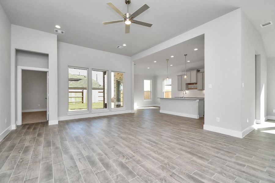 Take another glimpse into the heart of the home with this additional view of the family room—a sprawling space ready to accommodate all your gatherings. Sample photo of completed home with similar plan. As built color and selections will vary. Take another glimpse into the heart of the home with this additional view of the family room—a sprawling space ready to accommodate all your gatherings. Sample photo of completed home with similar plan. As built color and selections will vary.