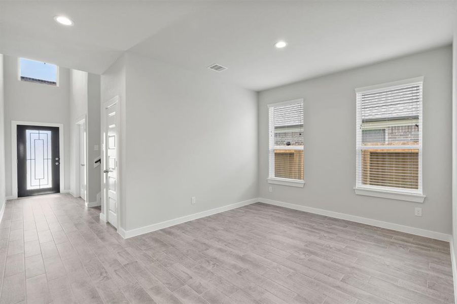 Make memories gathered around the table with your family and friends! This dining spacious room features elegant flooring custom paint, and immediately adjacent to kitchen for open concept feel. Sample photo of completed home. As-built color and selections may vary.