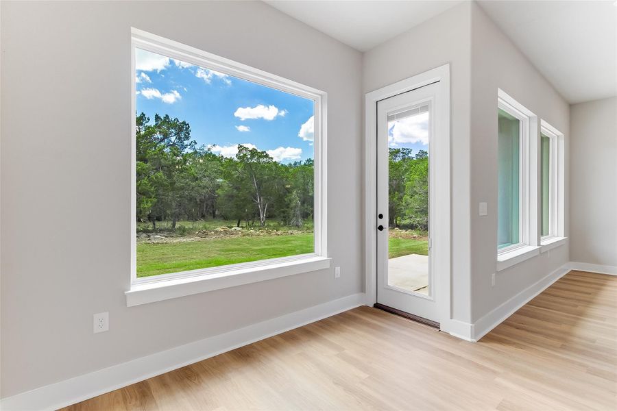 Oversized "picture" windows let in beautiful natural lighting and brings the outdoors inside Oversized "picture" windows let in beautiful natural lighting and brings the outdoors inside