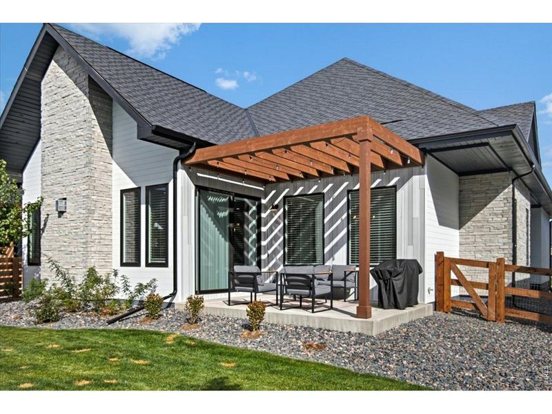 Exterior details and patio area of a home in Pelican Shores at Water Valley, Windsor (Image 25).