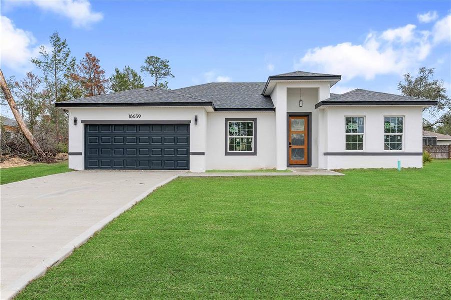 Front exterior of a new home in , Ocala, FL, highlighting curb appeal (Image 1).