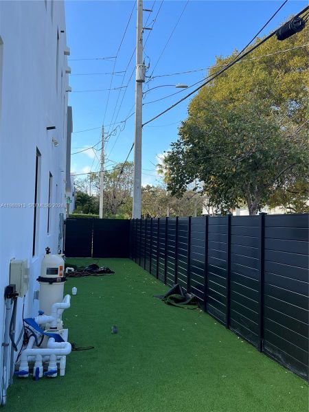 Exterior details and patio area of a home in , Miami (Image 16). Exterior details and patio area of a home in , Miami (Image 16).