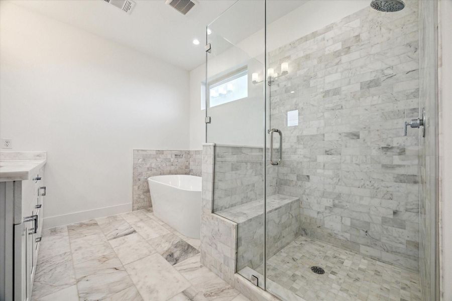 Separate Frameless Shower * Surrounded by Marble * Bench Seating.