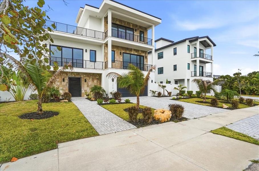 Front exterior of a new home in , Englewood, FL, highlighting curb appeal (Image 28).