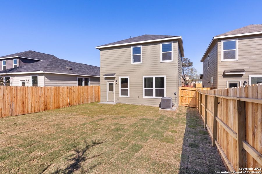 Exterior details and patio area of a home in Spanish Trails Villas, San Antonio (Image 3).