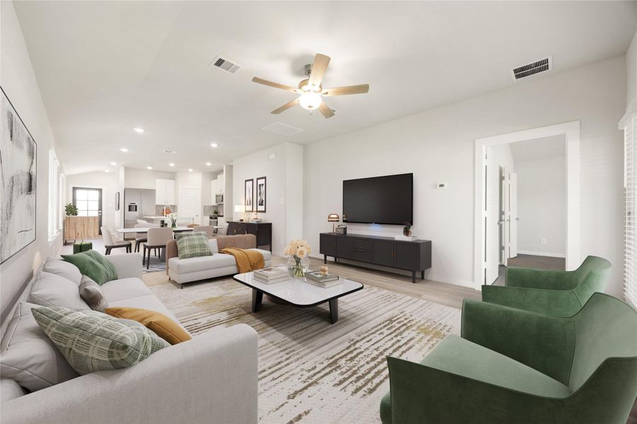 This bright and spacious living area features an open-concept design with large windows that fill the space with natural light. Neutral tones, recessed lighting, and luxury vinyl plank flooring create a warm and inviting atmosphere perfect for entertaining or relaxing.