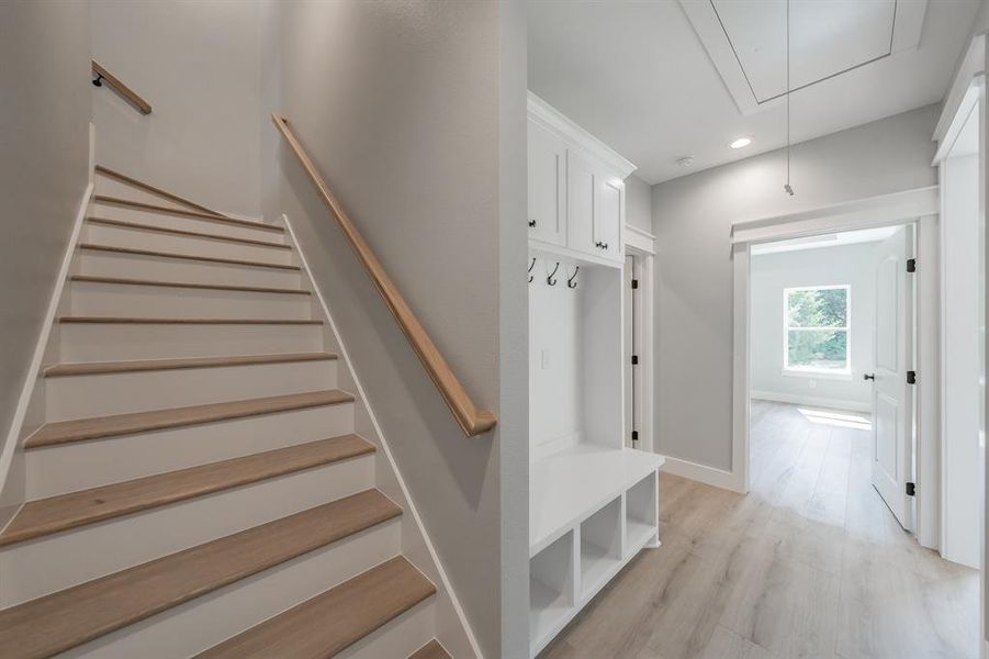 Stairs with light wood-type flooring