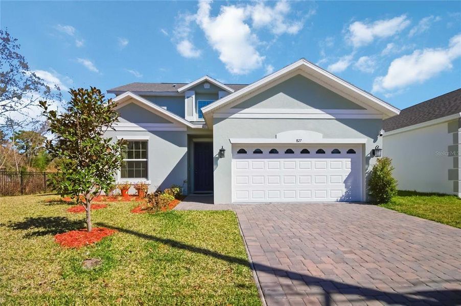 Front exterior of a new home in Blue Diamond , Orlando, FL, highlighting curb appeal (Image 2).