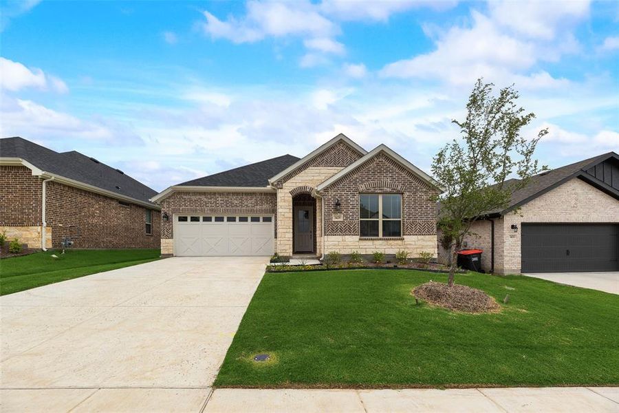 Front exterior of a new home in Villages of Hurricane Creek, Anna, TX, highlighting curb appeal (Image 2).