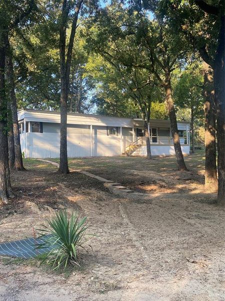 Front exterior of a new home in , Malakoff, TX, highlighting curb appeal (Image 17).