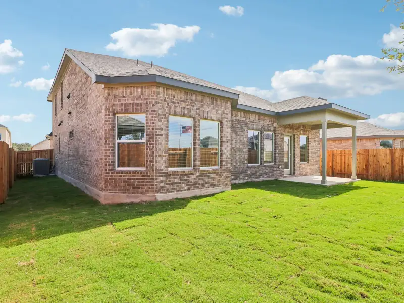 Exterior details and patio area of a home in Colony at Cole Springs - Boulevard Collection, Buda (Image 3).