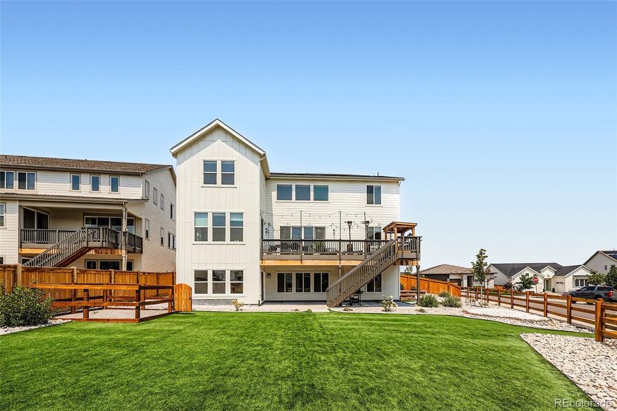 Front exterior of a new home in , Castle Pines, CO, highlighting curb appeal (Image 19).