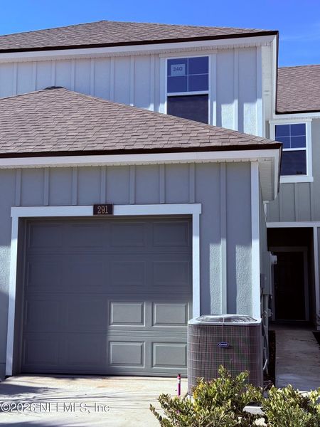 Front exterior of a new home in Liberty Cove, Yulee, FL, highlighting curb appeal (Image 18).