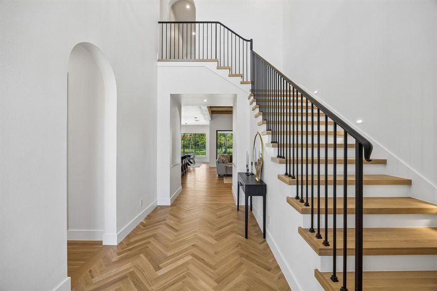 Light and bright entry timeless herringbone pattern.
