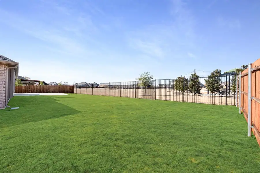 Exterior details and patio area of a home in Hayes Crossing, Midlothian (Image 4). Exterior details and patio area of a home in Hayes Crossing, Midlothian (Image 4).
