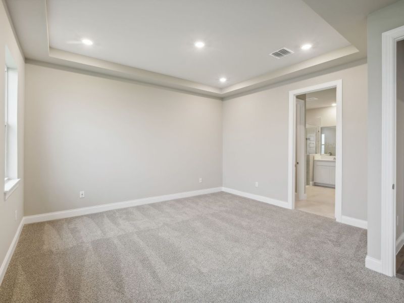 Primary Bedroom in the Coral floorplan at 6398 NW Sweetwood Dr