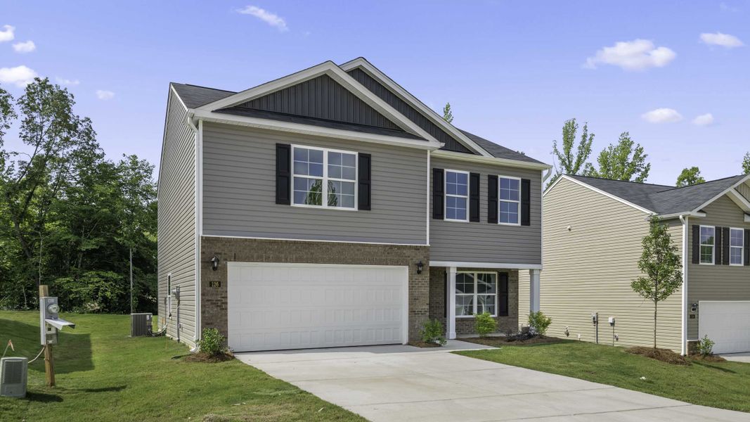 Front exterior of a new home in Greystone North, Stoneville, NC, highlighting curb appeal (Image 2). Front exterior of a new home in Greystone North, Stoneville, NC, highlighting curb appeal (Image 2).
