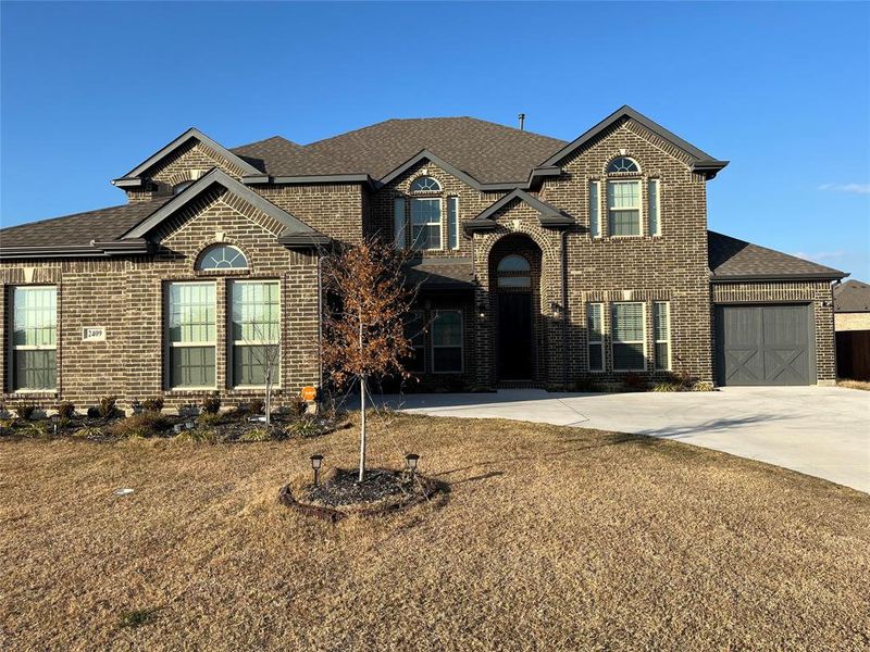 Front exterior of a new home in Shady Valley Estates, Midlothian, TX, highlighting curb appeal (Image 14).