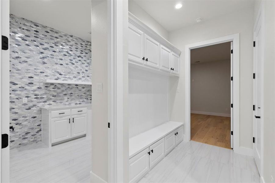 View of mudroom, laundry room, and media room