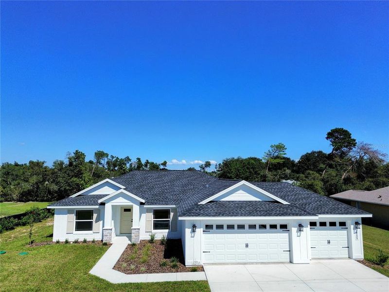 Front exterior of a new home in , Ocala, FL, highlighting curb appeal (Image 27).