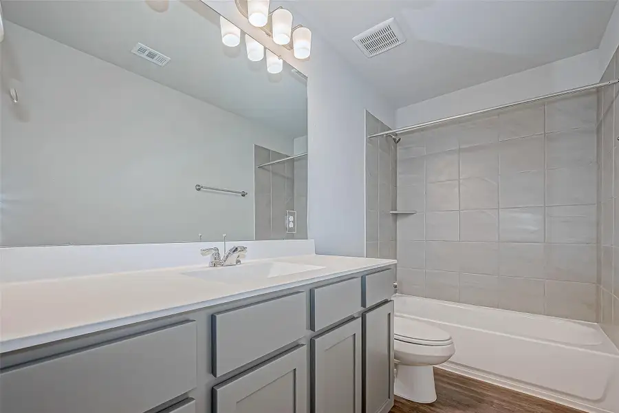 Furnished interior view inside a new home in Mill Creek Trails, Magnolia (Image 8).