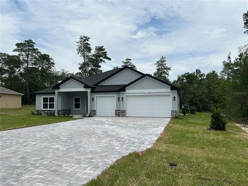 Front exterior of a new home in , Dunnellon, FL, highlighting curb appeal (Image 15). Front exterior of a new home in , Dunnellon, FL, highlighting curb appeal (Image 15).